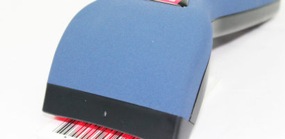 Axicon 6015 barcode verifier facing left close up on product