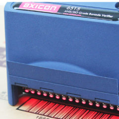 Axicon 6515 barcode verifier facing left scanning document