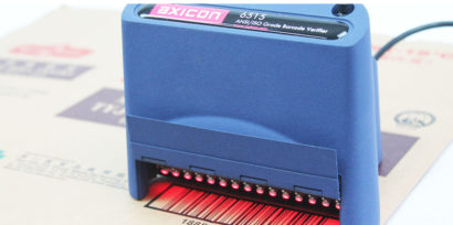 Axicon 6515 barcode verifier facing left scanning document