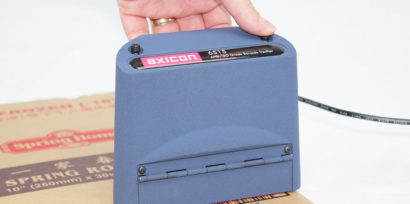 Axicon 6515 barcode verifier hand held scanning docuemt facing right