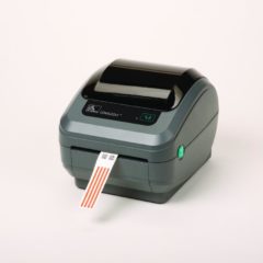 Zebra GX420D 203 Dpi Direct Thermal Desktop Label Printer Right Facing With Label