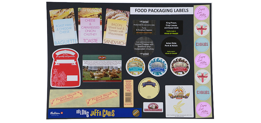 Selection of pre-printed food packaging labels in different styles, shapes and sizes. Eg. for baguettes, pickled sliced beetroot and cookies.