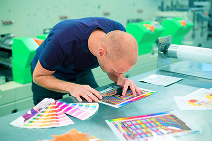 Man working in design studio with colours