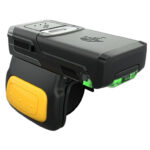 Close-up angled view of the Zebra RS5100 wearable ring scanner, showcasing its lightweight and compact design with a yellow trigger button and green LED light for feedback. The device features a comfortable finger strap and advanced 1D and 2D barcode scanning technology, optimized for hands-free productivity in warehouse, retail, and industrial environments.
