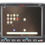 Thor VM3A Vehicle Mounted Computer featuring a large touchscreen display and dedicated function keys, installed on a vehicle dashboard for industrial and logistics operations. Designed to withstand tough environments, it provides reliable data access and management in transportation and warehouse settings.