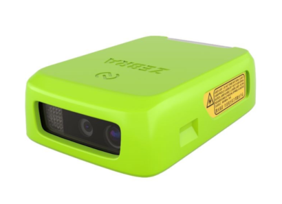 Angled view of the Zebra RS2100 wearable scanner in bright green, showcasing its compact design with a visible barcode scanner lens and safety warning label on the side. Designed for efficient hands-free scanning in industrial environments.