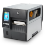 Zebra ZT411L linerless industrial label printer with color touch display, side media window, and direct thermal printing for high-volume label production without backing liners.