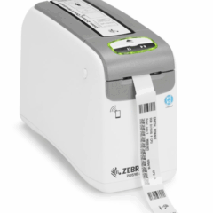 Zebra ZD510-HC healthcare wristband printer printing a patient ID wristband, designed for hospital and medical environments, featuring smart media technology and antimicrobial casing.