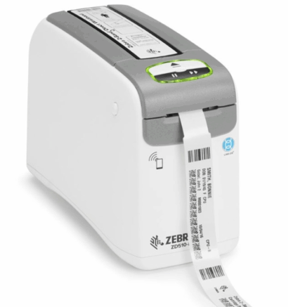 Zebra ZD510-HC healthcare wristband printer printing a patient ID wristband, designed for hospital and medical environments, featuring smart media technology and antimicrobial casing.